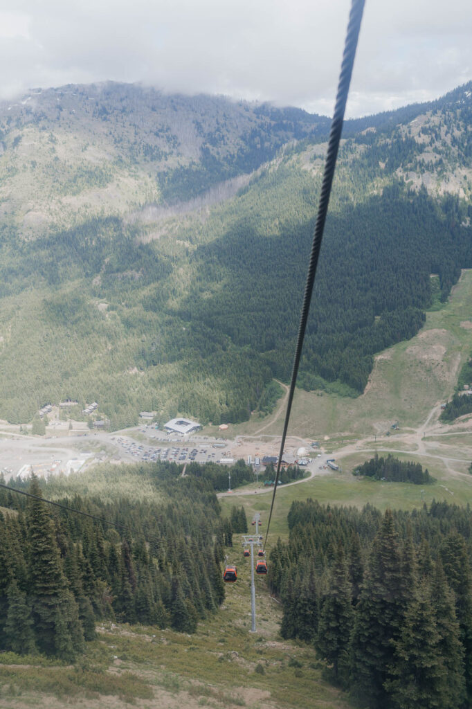 A view of the base of Crystal Mountain while riding the gondola up to the Mt. Rainier Platform on a summer wedding day.