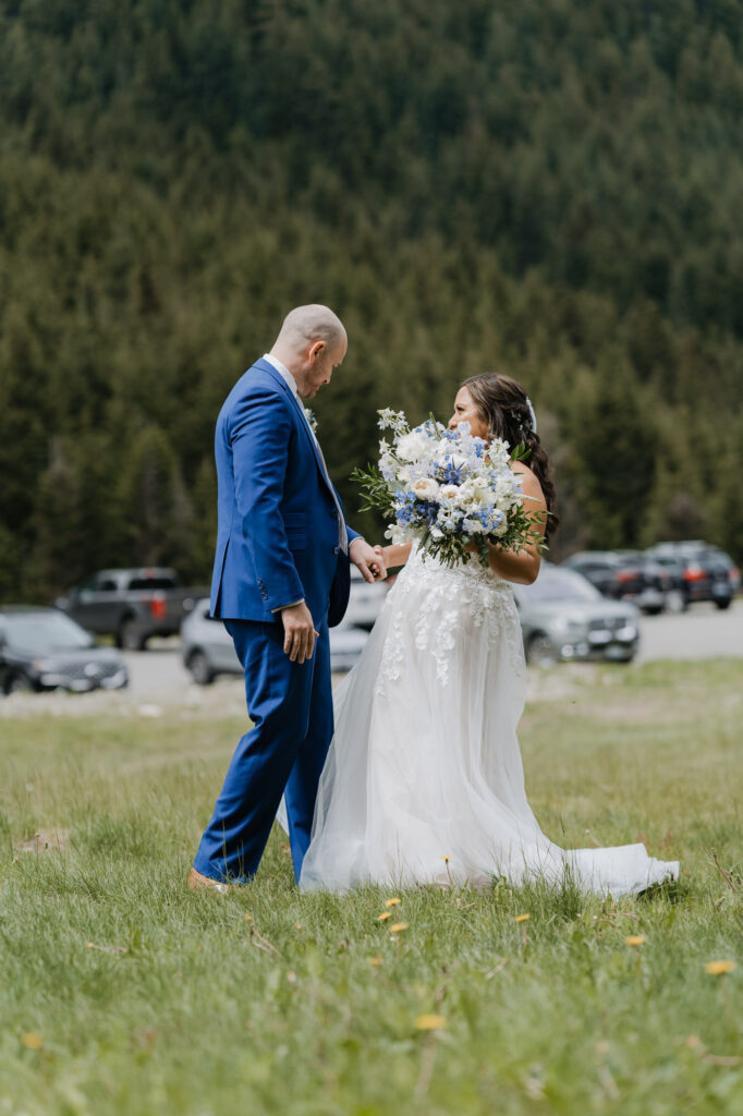A bride and groom get emotional while seeing each other for the first time on their wedding day at Crystal Mountain in Washington State. 
