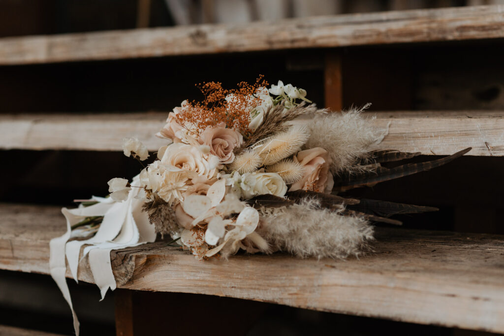 A boho bouquet sits on the steps of a cabin in Packwood, WA